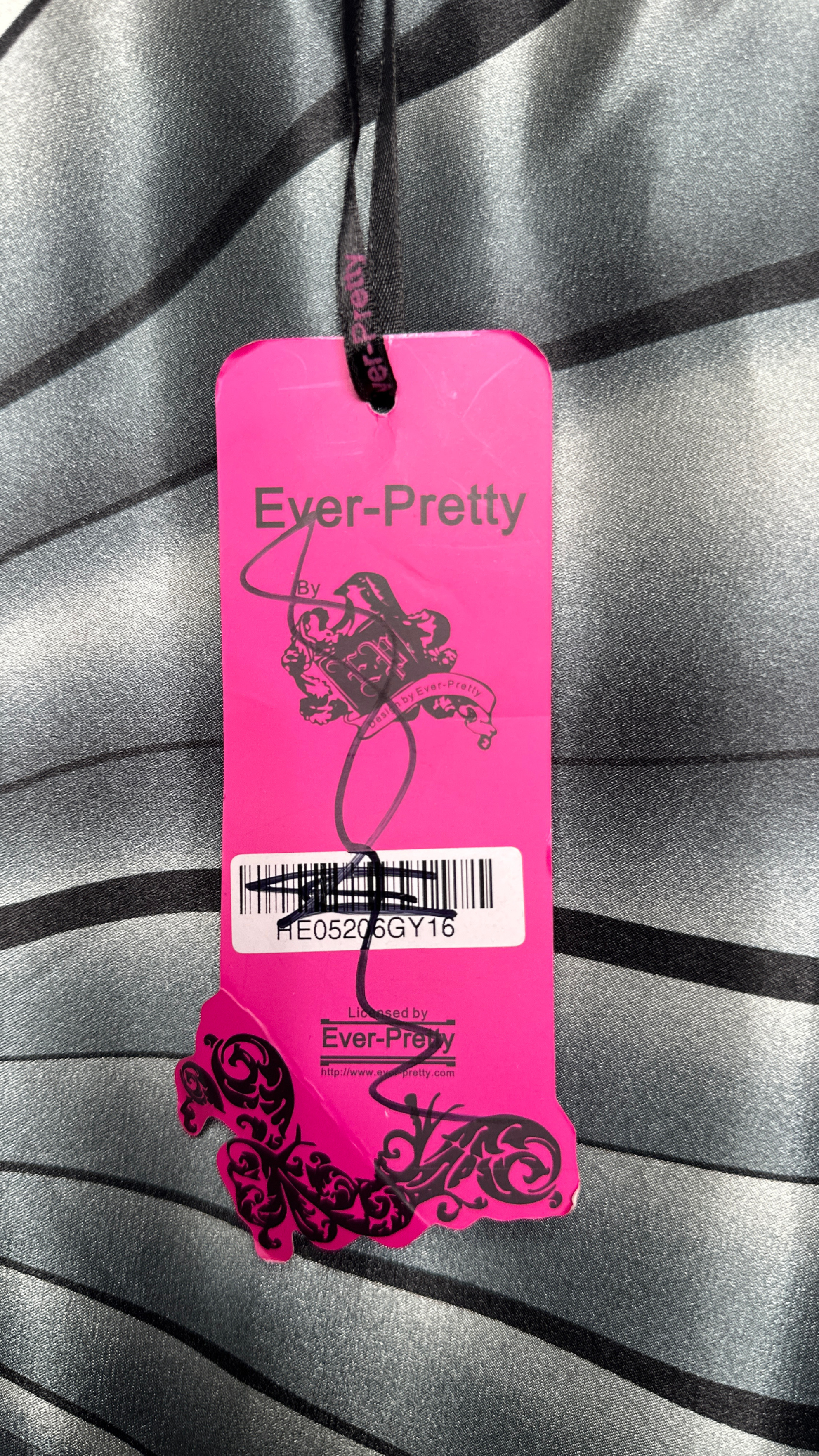 Pink 'Ever-Pretty' brand tag on a textured gray background
