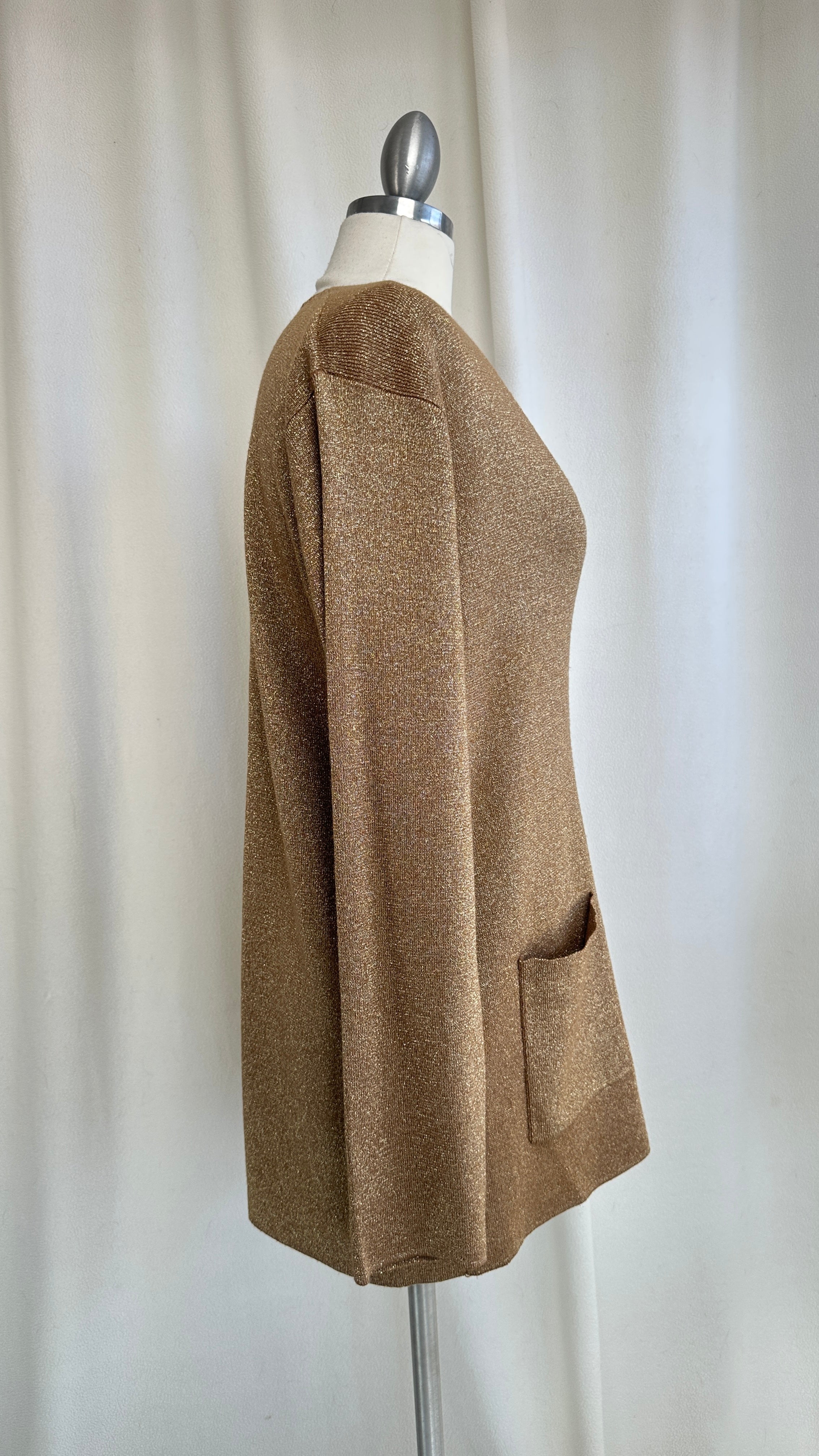 Brown cardigan on a mannequin against a plain background