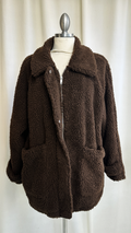 Brown teddy coat on a mannequin against a white background