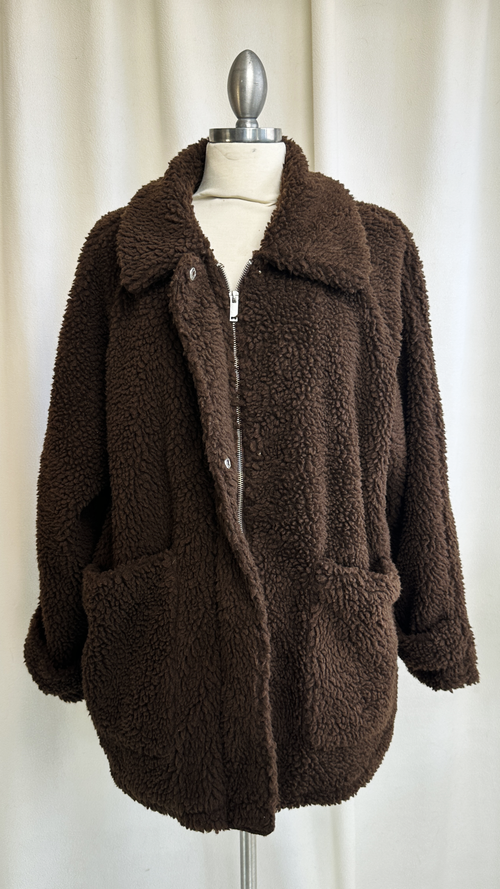 Brown teddy coat on a mannequin against a white background