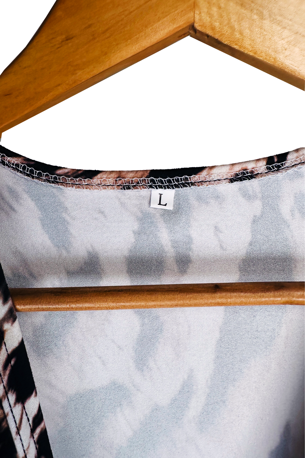 Interior back neckline detail with overlock-finished edge. A single white tag reads "L". No brand or fiber-content label is visible.