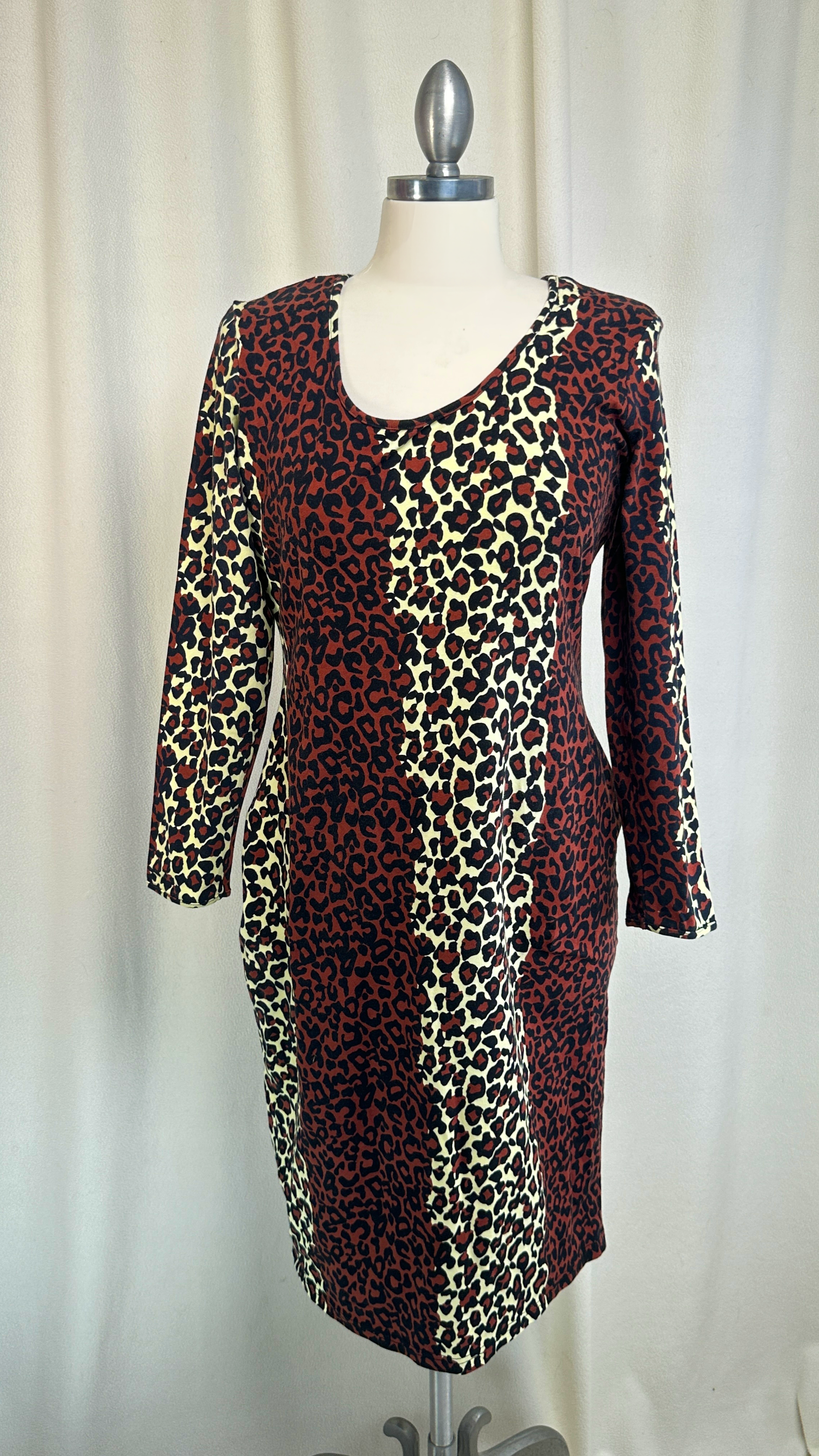 Leopard print dress on a mannequin against a plain background