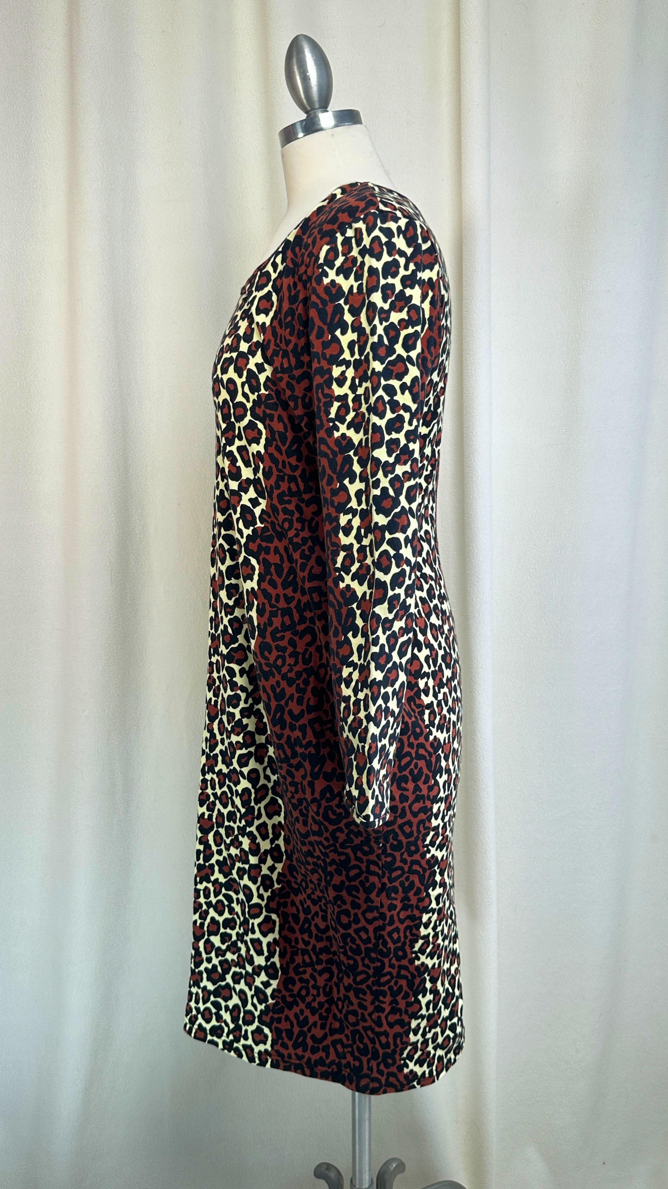 Leopard print dress on a mannequin against a plain background